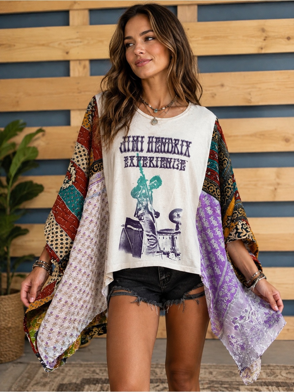 Upcycled JIMMY HENDRICKS graphic poncho with kantha sleeves